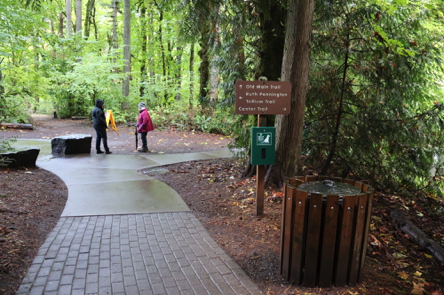 Trailhead off Friends Circle – trash can and doggie bags – leads to trail junction – directional signage